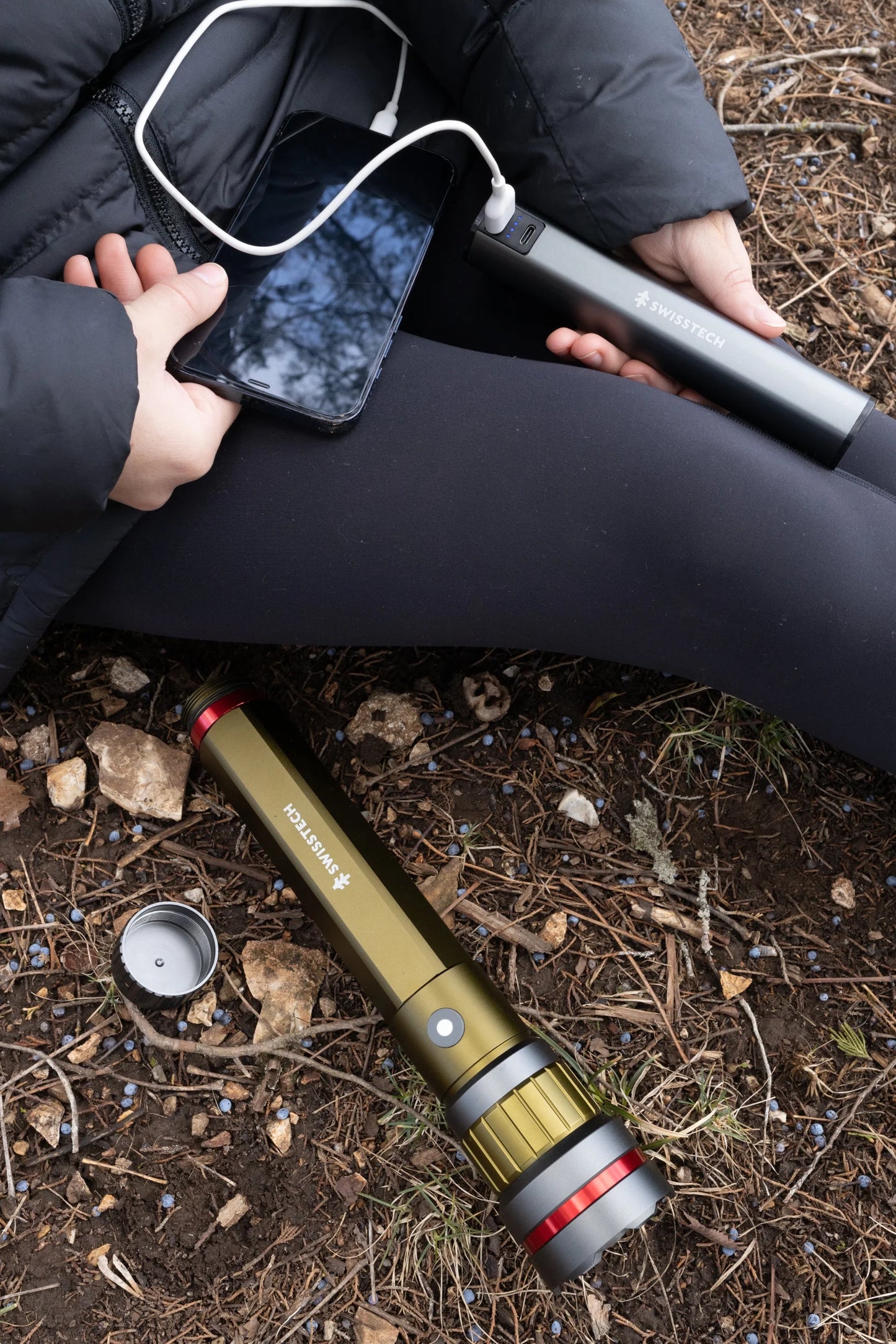 "6500 Lumen Rechargeable LED Flashlight - dual power AA/USB, built-in charging bank, and IP67 waterproof design."