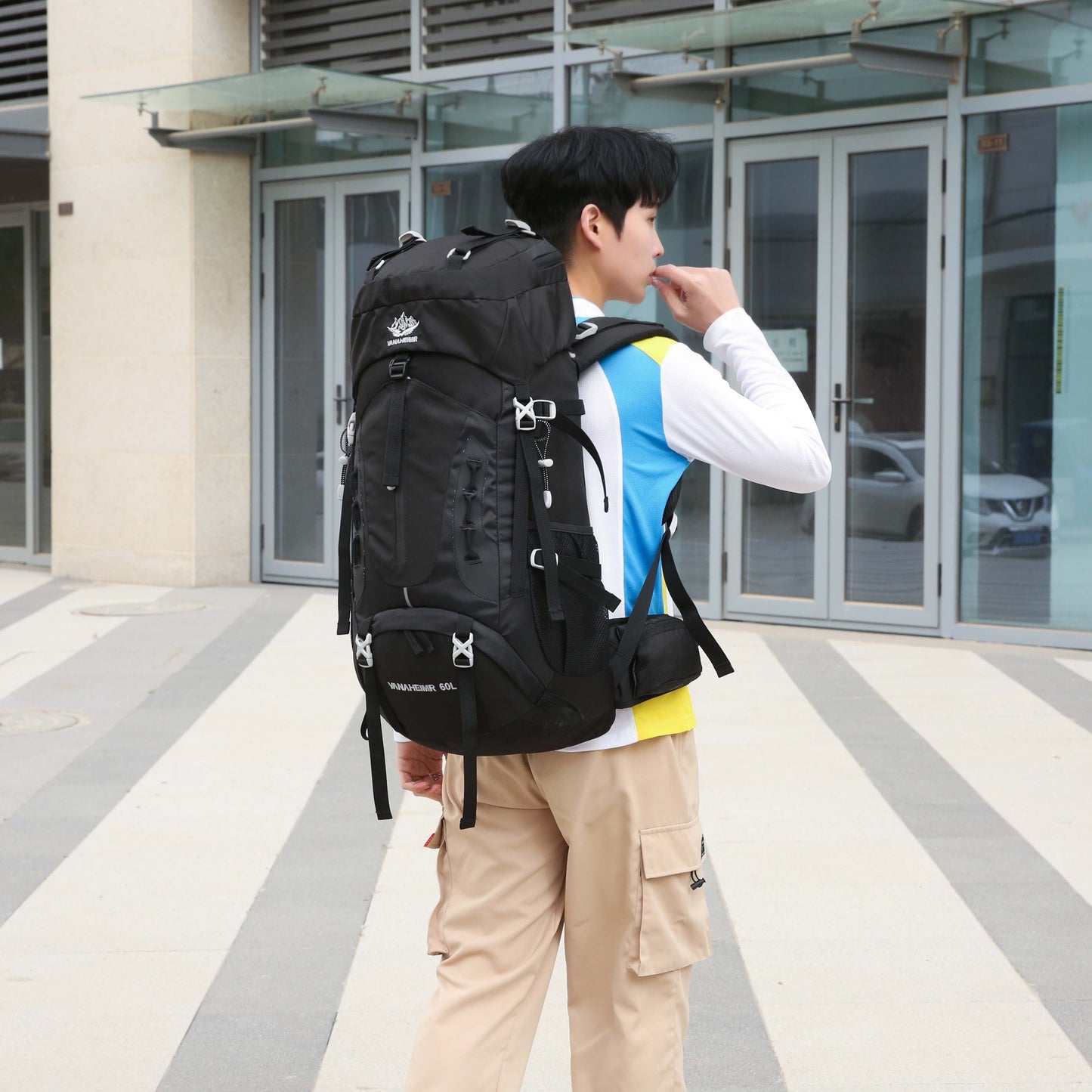"TrekMate 60L Waterproof Travel Backpack with rain cover - perfect for hiking, camping, and outdoor adventures."