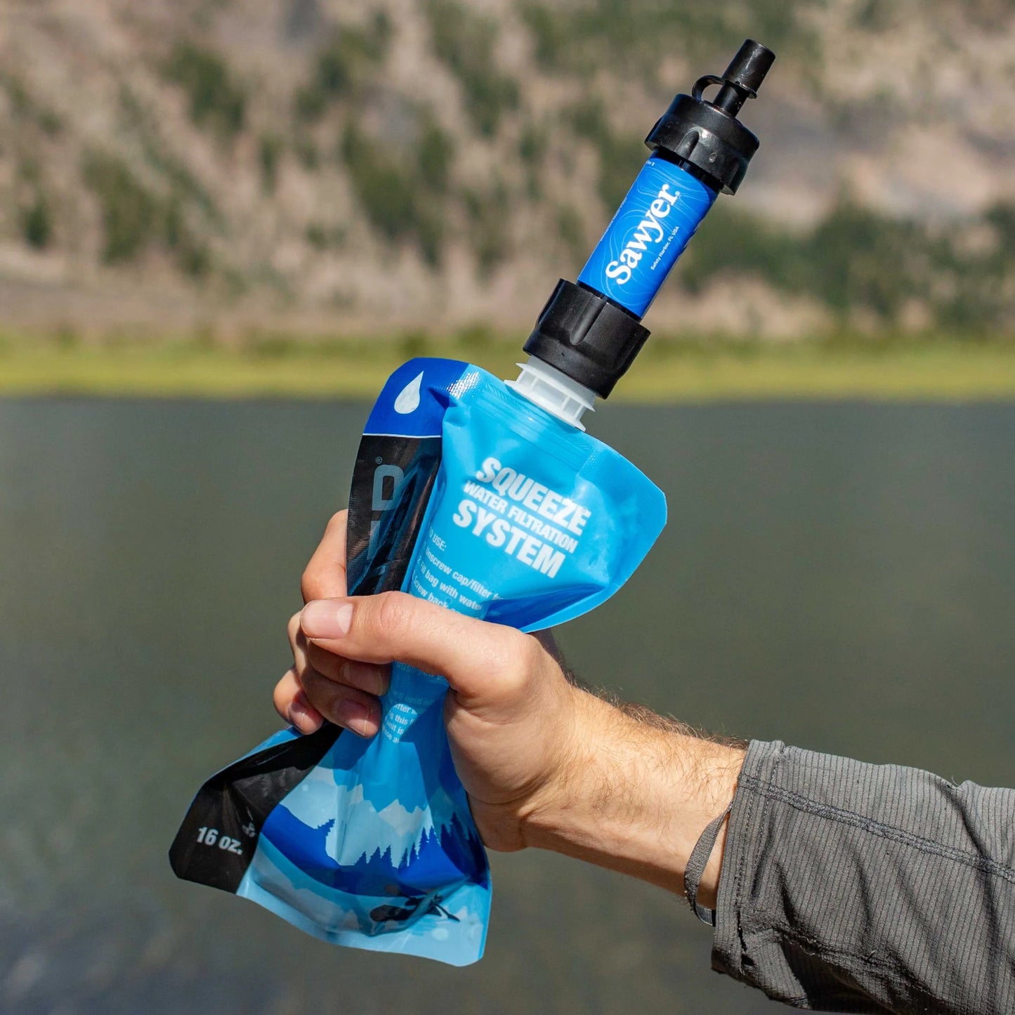 "Sawyer SP128 MINI Water Filter - ultralight 0.1 micron survival water purifier in blue for emergencies and camping."