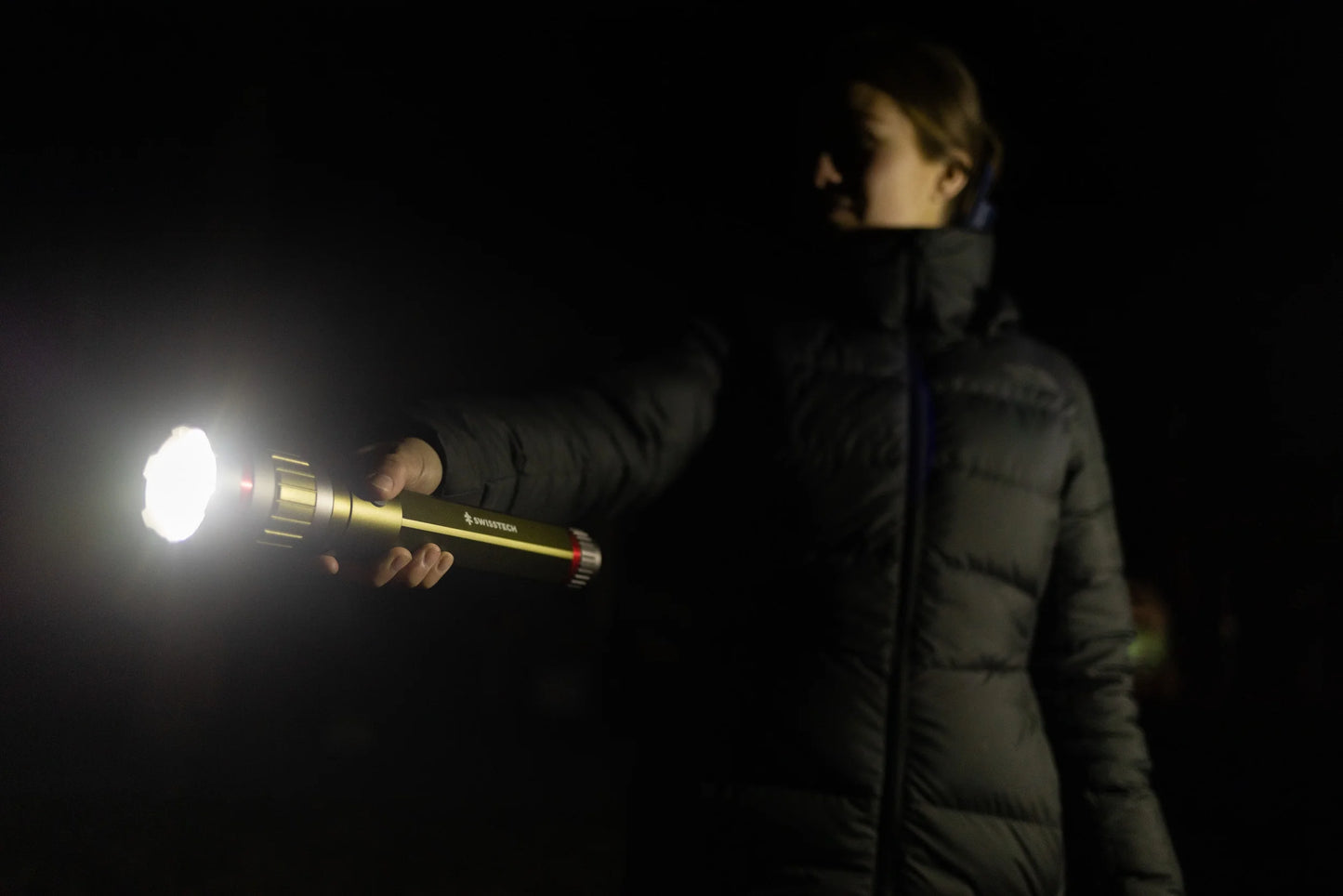 "6500 Lumen Rechargeable LED Flashlight - dual power AA/USB, built-in charging bank, and IP67 waterproof design."