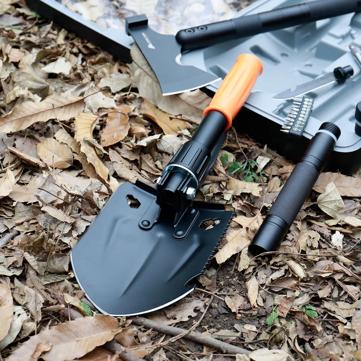 Image of a Survival Kit with a 15.35" high-carbon steel folding shovel, featuring a compact design, multi-tool functionality, and a durable hard case, ideal for emergency preparedness and outdoor use, displayed on a clean white background.