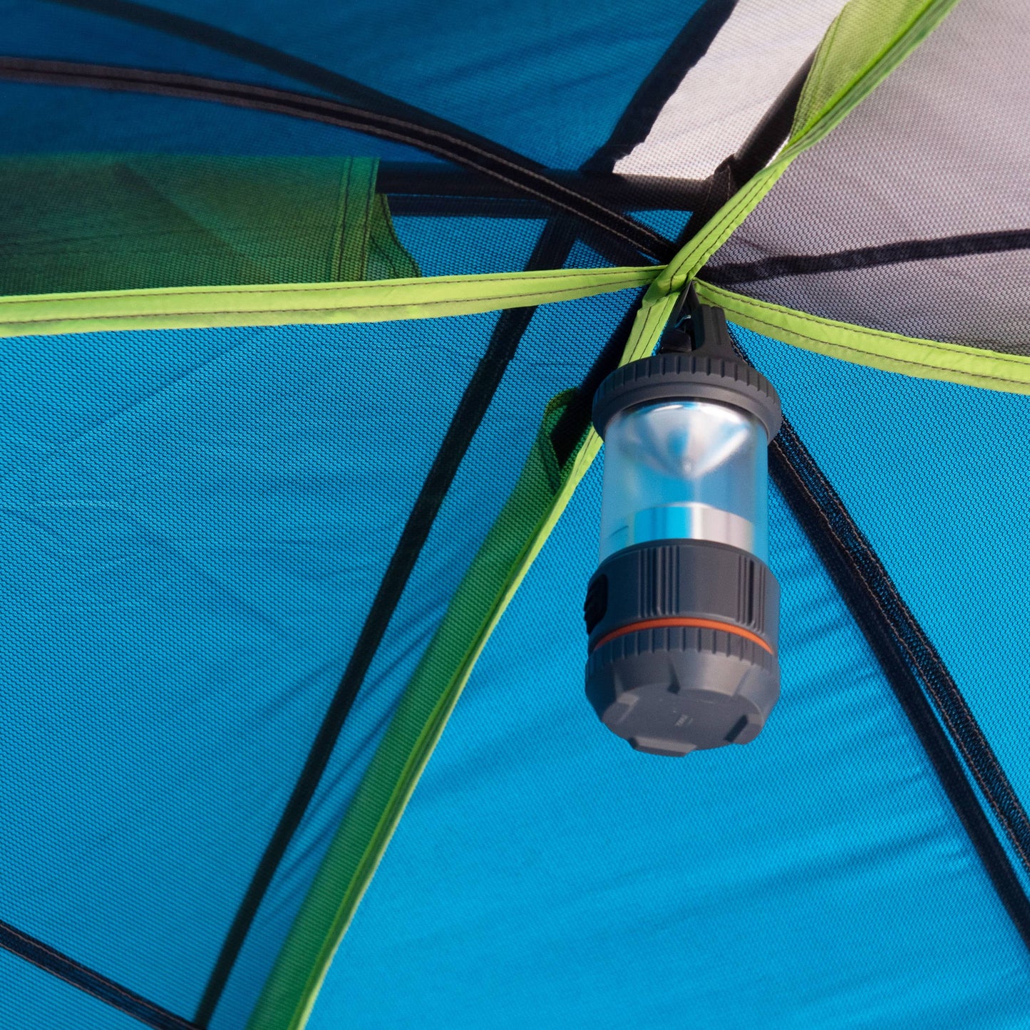 "10-Person Modified Dome Tent with Screen Porch set up in a forest campsite, showcasing its spacious design and inviting screen porch."