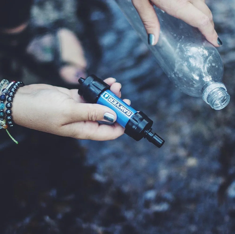 "Sawyer SP128 MINI Water Filter - ultralight 0.1 micron survival water purifier in blue for emergencies and camping."
