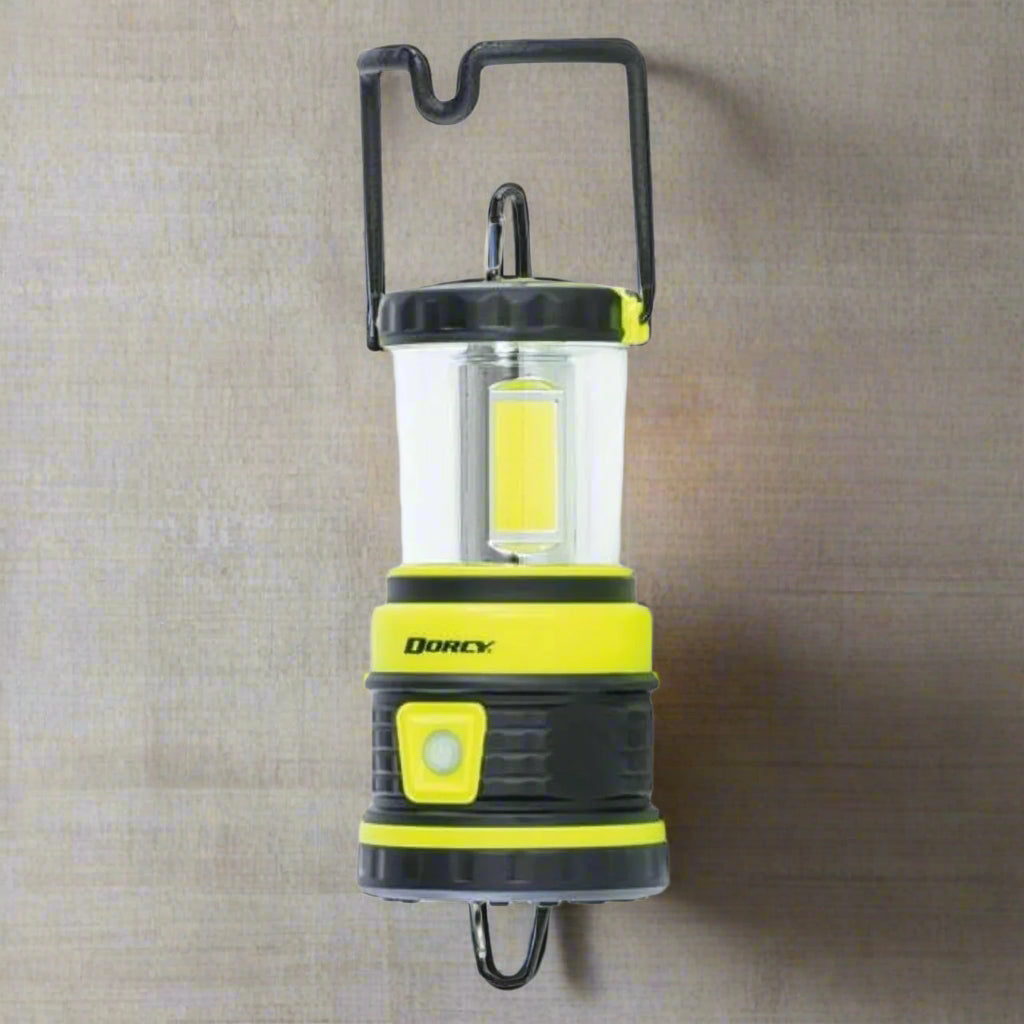 Image of the Dorcy 1800 Lumens Portable Camping Lantern featuring high brightness, multiple light modes, and a USB charging port, ideal for outdoor adventures and emergency preparedness, displayed on a clean white background.
