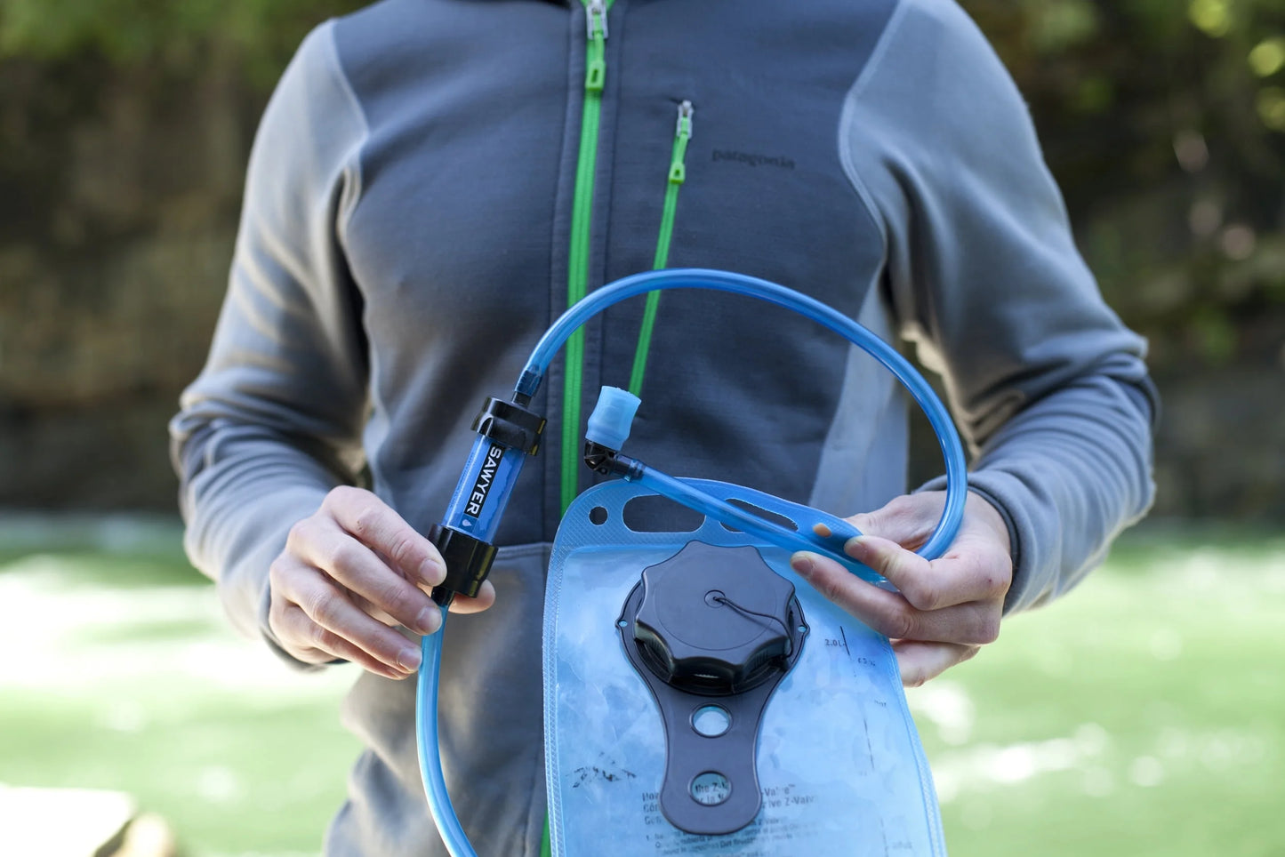 "Sawyer SP128 MINI Water Filter - ultralight 0.1 micron survival water purifier in blue for emergencies and camping."