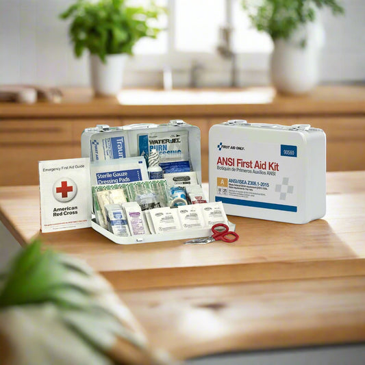 "Class A 25-Person First Aid Kit in a durable metal case, wall-mounted, showcasing its weatherproof design and organized supplies."
