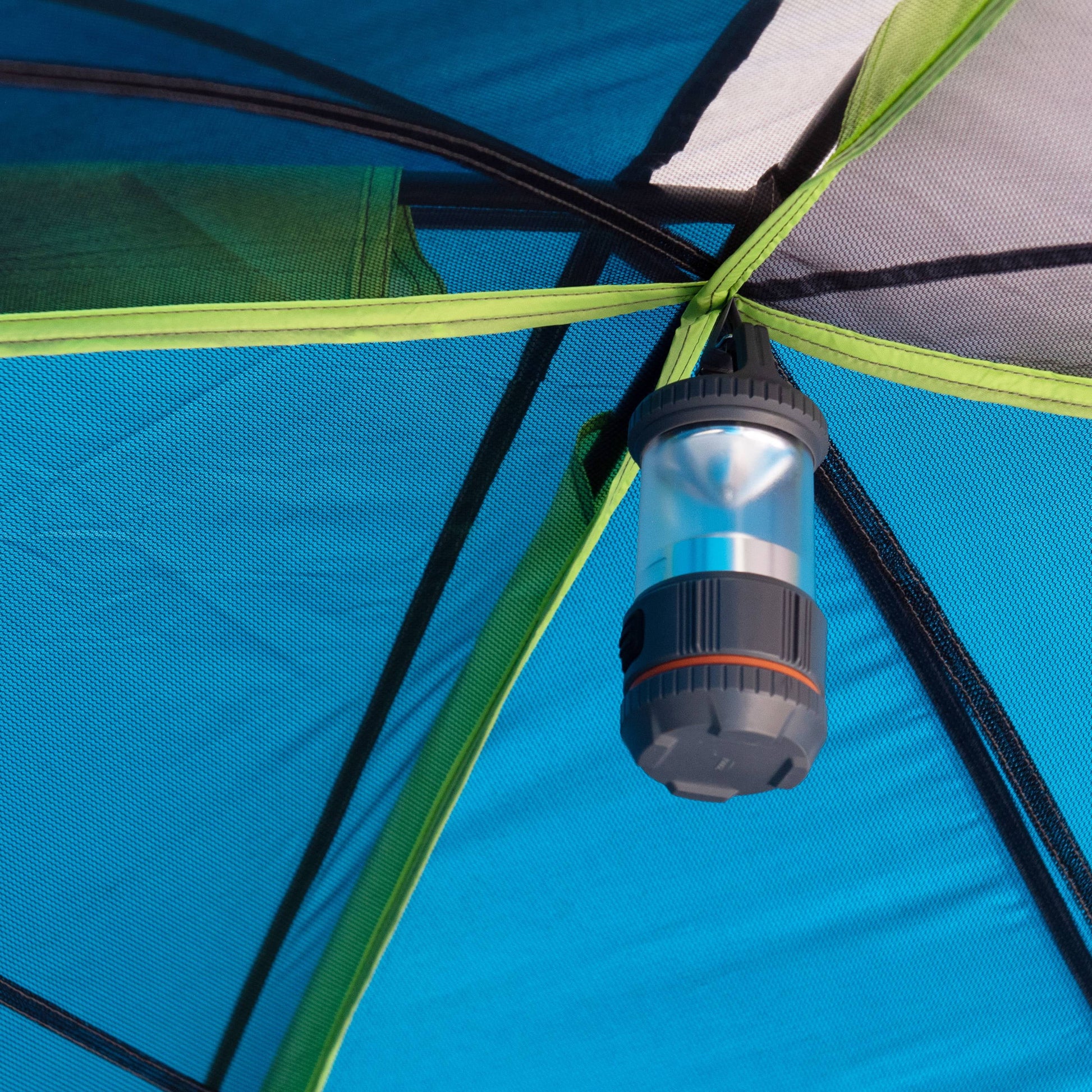 "10-Person Modified Dome Tent with Screen Porch set up in a forest campsite, showcasing its spacious design and inviting screen porch."

